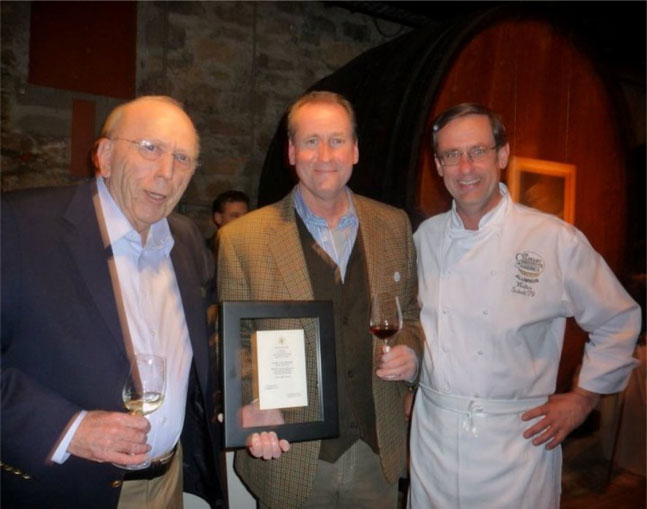 John Concannon, holding a 1984 White House menu, featuring Concannon Wine served to the Prime Minister of Ireland by President Ronald Reagan, 2011