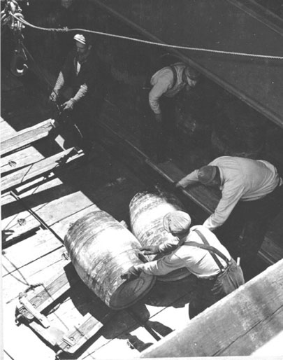 Crew members stow Concannon for a trip across the sea, 1941
